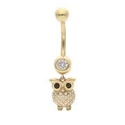 Gold owl-shaped belly button ring with a central gemstone on a white background