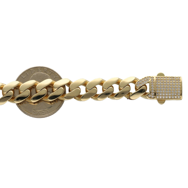 14k Ankle Bracelet on top of a 25 cent as a reference to a size guide.
