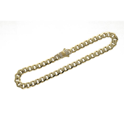 A 14 karat gold anklet with clear zirconia stones with the word ROMA, featuring a Cuban-link design.