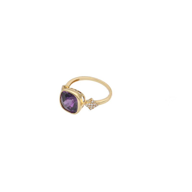 Gold ring with a purple gemstone on a white background
