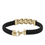 A black leather bracelet with gold-colored accents and textured Cuban links, featuring a lobster lock clasp.