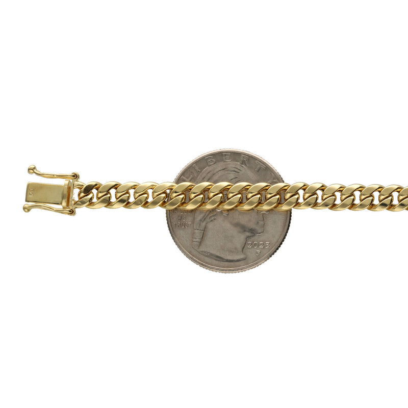 5 MM Authentic Real 14k Yellow Gold Miami Cuban Link  Hollow on a quarter coin to be on a white background.