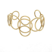 A 14 karat gold-colored bracelet with a geometric circular pattern, displayed against a white background.