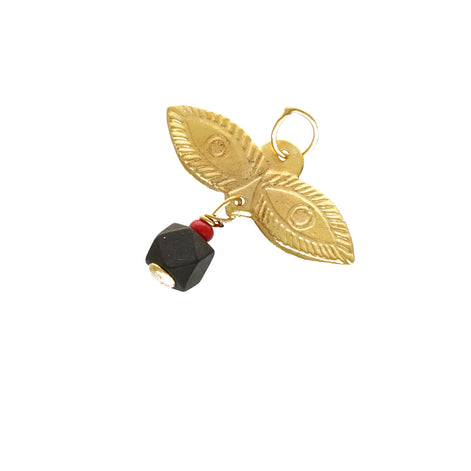 Close-up of Santa Lucia protective eyes design in 14K gold with azabache stone detail