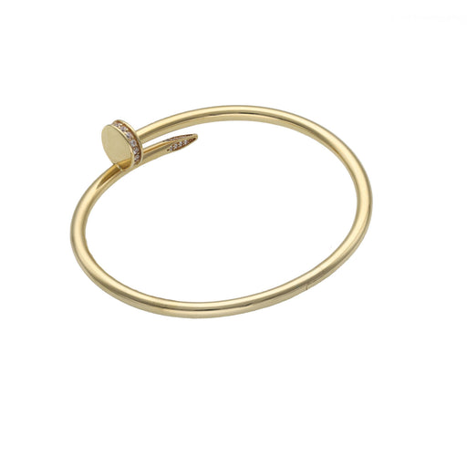 14 Karat Gold Nail Bracelet solid construction with cubic zirconium stones around the head of the nail and the tip of it.