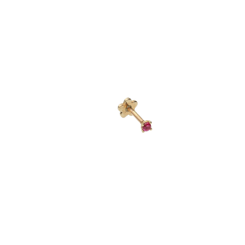 a 14k yellow gold and synthetic ruby flat back stud on a side angle with a white background.