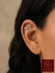 14k yellow gold dragonfly cartilage earring with sparkling clear stones worn on a helix piercing. Flat back labret stud by VEKA Jewelry.