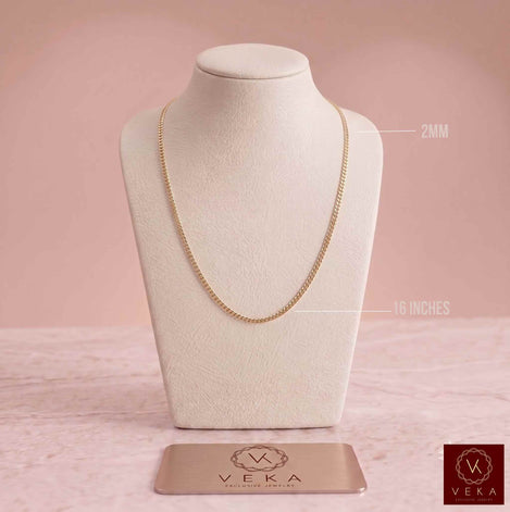 2.5mm solid 10k yellow gold Italian curb chain necklace displayed on a beige necklace bust stand by Veka Jewelry