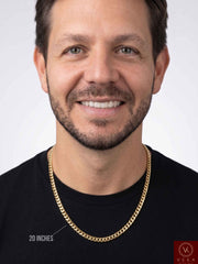 Close-up look of a male model wearing a 5mm Solid 14K Yellow Gold Miami Cuban Link Chain over a casual black t-shirt, highlighting the gold luxury necklace drape.