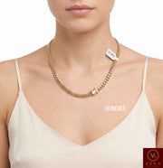 Female model showcasing a 6mm 14k solid gold Cuban link chain in 18 inches length.