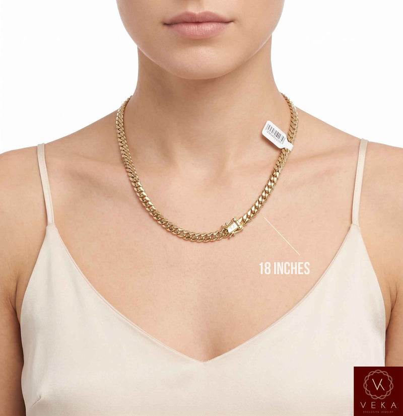 Female model showcasing a 6mm 14k solid gold Cuban link chain in 18 inches length.
