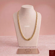 6mm 14k solid gold Cuban link chain in 20 inches displayed on a luxury bust stand by Veka Jewelry