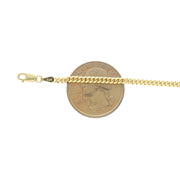 Anklet next to. a25 cents coin to compare to the actual size.