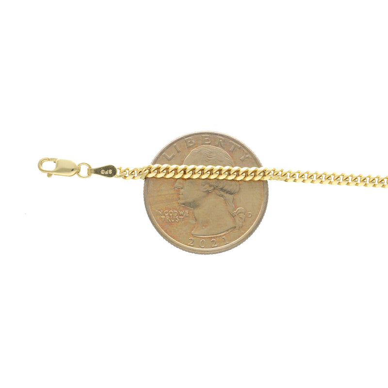 Anklet next to. a25 cents coin to compare to the actual size.