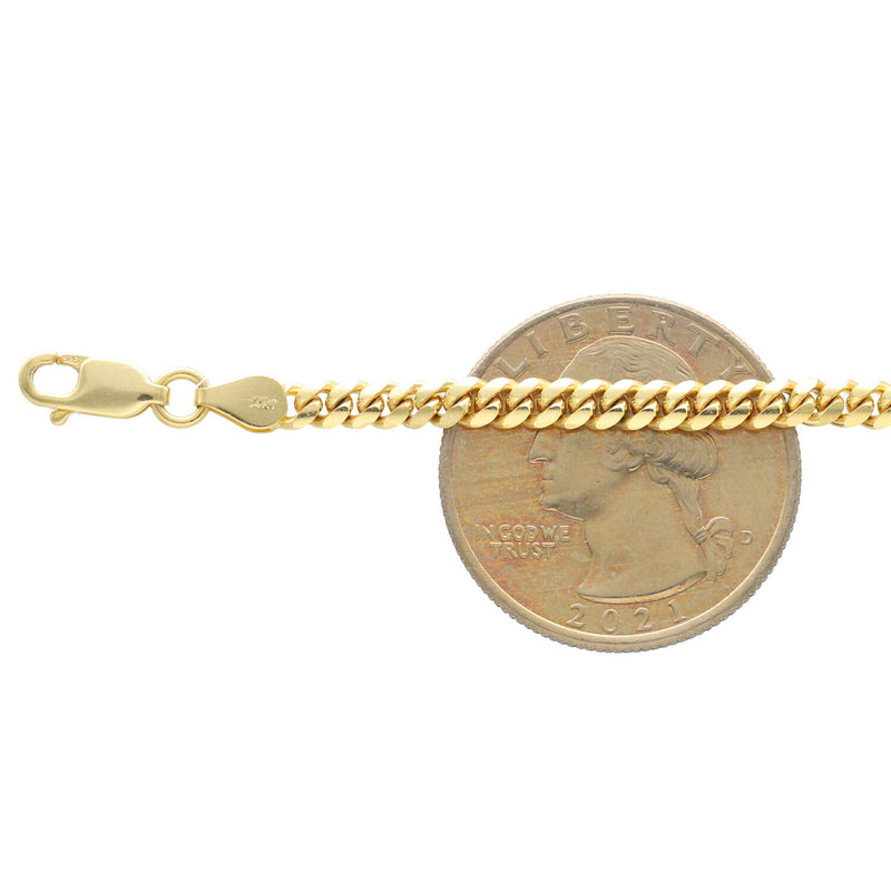 4 mm 14k Anklet Miami Cuban Link on a 25 cent coin to compare the size.