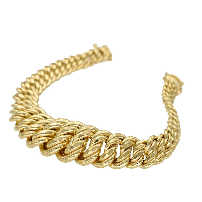 Side view of a 10K yellow gold princess cut bracelet showing the graduated tapering width and semi-solid gold construction