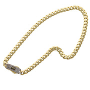 A real Yellow Gold made of 14K Gold anklet bracelet with a cuban link chain design and a sparkling push to pen secure clasp with the logo of the known brand Oro Monaco.