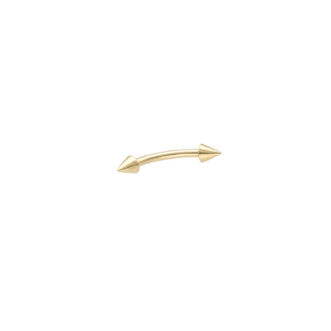A 14 karat gold eyebrow piercing with a curved design and arrows, presented on a white background.