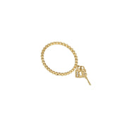  14K yellow gold heart lock and key ring with cubic zirconia accents on white background