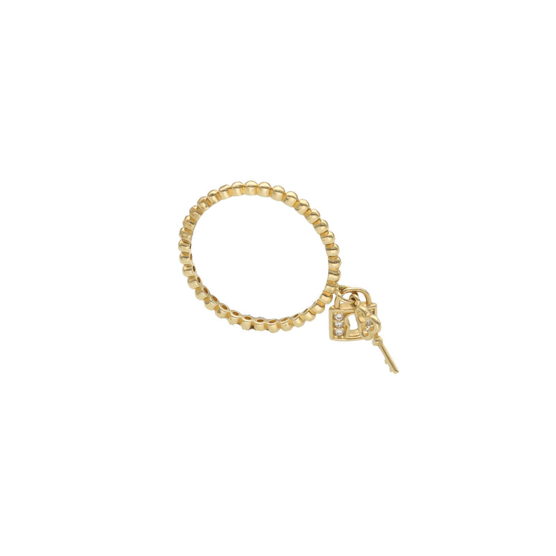  14K yellow gold heart lock and key ring with cubic zirconia accents on white background