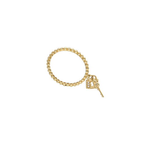  14K yellow gold heart lock and key ring with cubic zirconia accents on white background