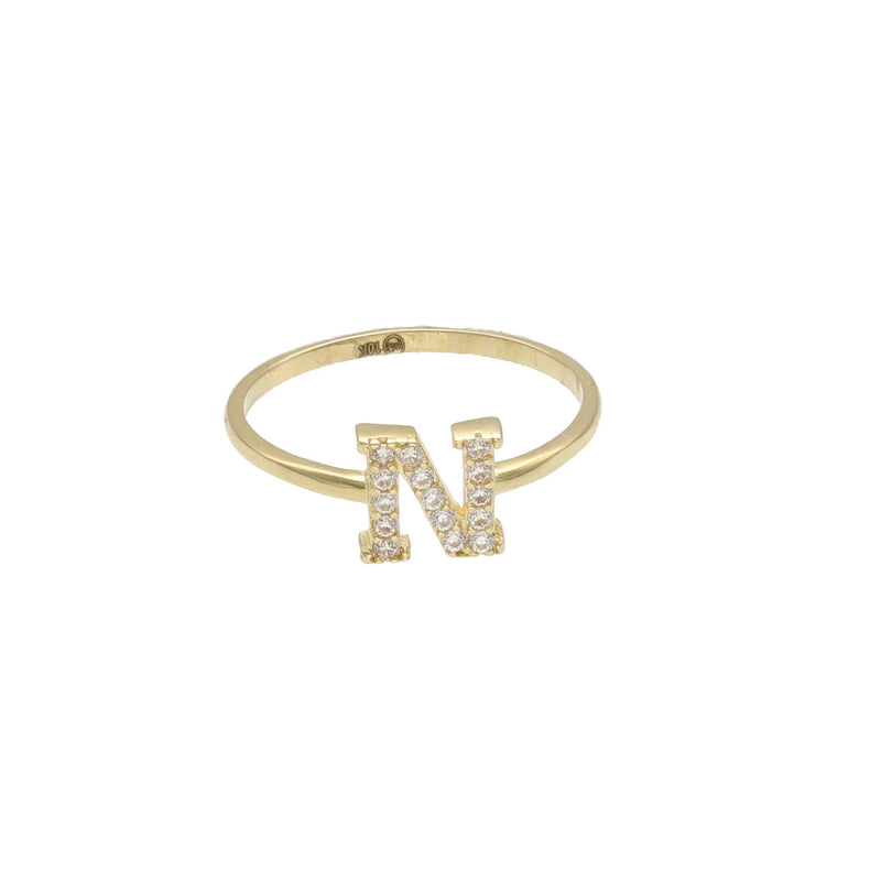 A yellow gold ring with a single initial 'N' adorned with zirconia stones.