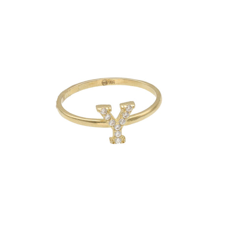 A yellow gold ring with a single initial 'Y' adorned with zirconia stones.