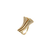 Close-up detail of 14K gold sculptural wave ring showing sparkling cubic zirconia stones and flowing design