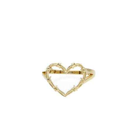 A 10 karat gold heart-shaped like Carol G ring with visible texture details on a white background.