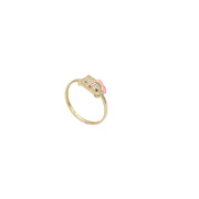 Kitty Gold Ring with the shape of a kitty. The kitty is set with stones while the bow is pink , the eyes are round and red nose on white background. The ring is set on 45 degree view
