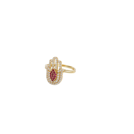 Luxurious 14 karat Gold Hamsa Ring with vibrant synthetic ruby center and sparkling clear stones, elegant 2025 jewelry design, set against a white background.