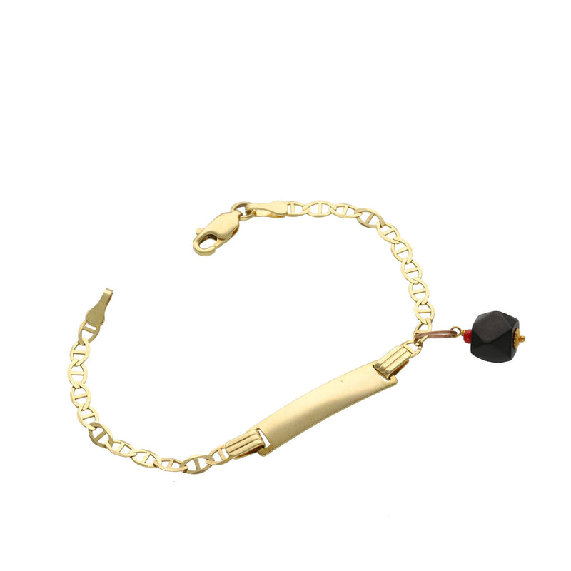 A close up of a 14k Mariner Gold bracelet  with tad and with a black bead  azabache on a white background