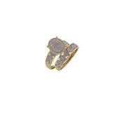 A 14 karat gold ring with a central engagement ring surrounded by a ceremony smaller band, both set with natural diamonds.