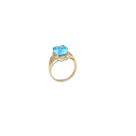 A 14 karat gold ring with a blue topaz stone set in a yellow gold band.