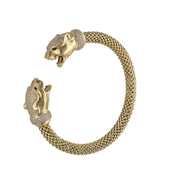 Close-up of two panther heads with CZ eyes on 14K gold popcorn chain bangle showing fierce animal design details