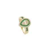 A luxurious 14-karat Gold ring featuring pear-shaped cluster of vibrant green synthetic emerald gemstones. surrounded by sparkling zirconium stones, set against a neutral white background.
