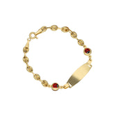 A 14 karat gold bracelet featuring a mariner chain design with red and black ladybug accents and a personalized ID plate.