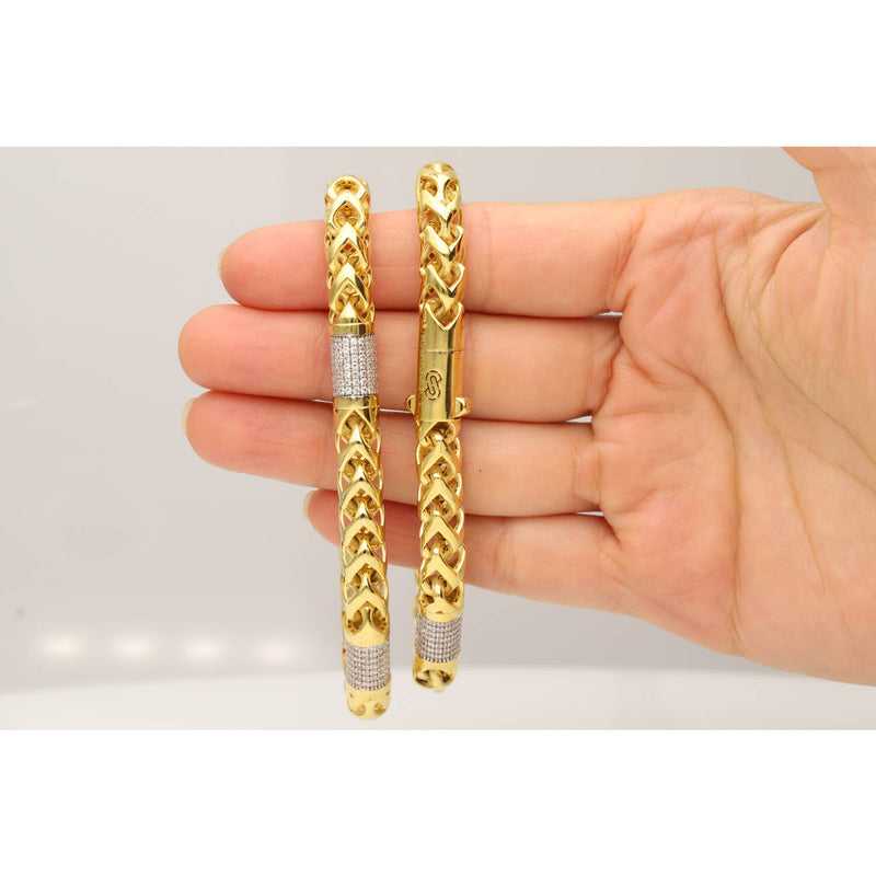 Person wearing 10K gold Monaco Rondo bracelet showing sophisticated luxury jewelry style