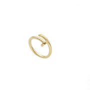 A simple yet elegant yellow gold ring with a nail-like protrusion on one side, in a white background