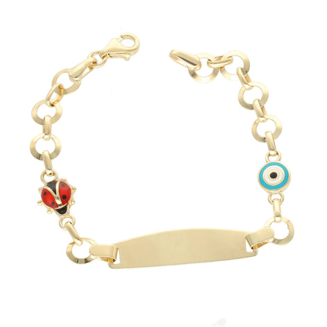 A 14 Karat Gold ID Ladybug Kids Bracelet with a small red ladybug charm and a blue eye charm on a gold chain.