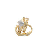 A set of three 14 karat gold rings with zirconia stones, including one engagement ring and two bands for women and men with the engraving Forever in both men and women band on white background.