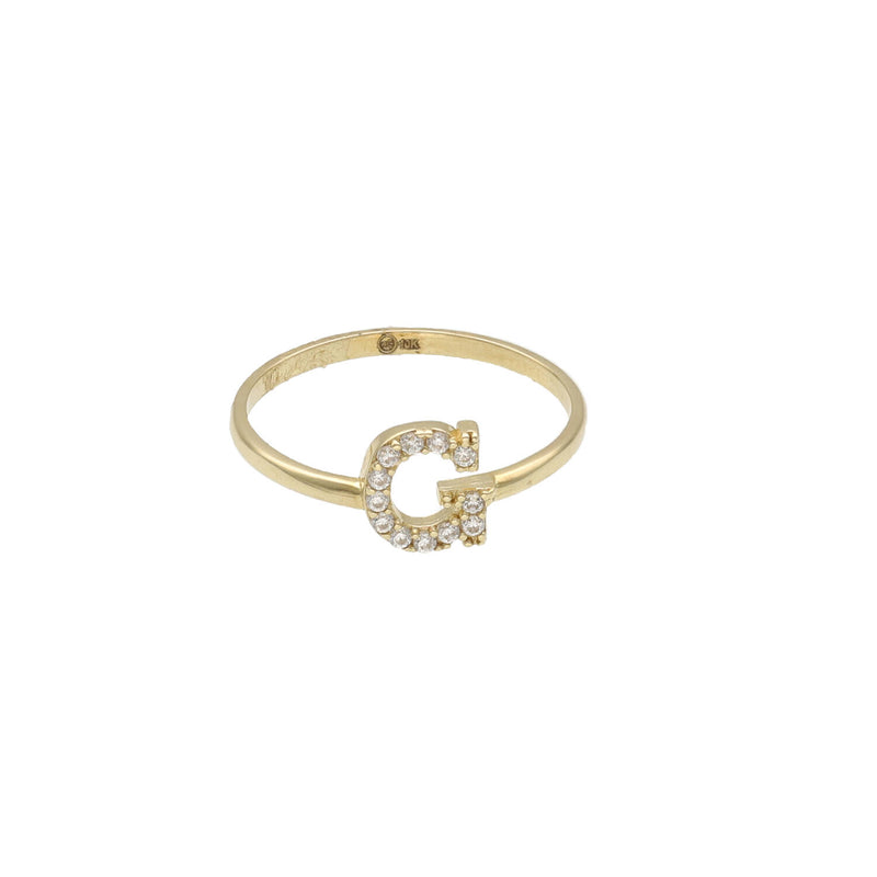A yellow gold ring with a single initial 'G' adorned with zirconia stones.