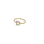 A yellow gold ring with a single initial 'D' adorned with zirconia stones.