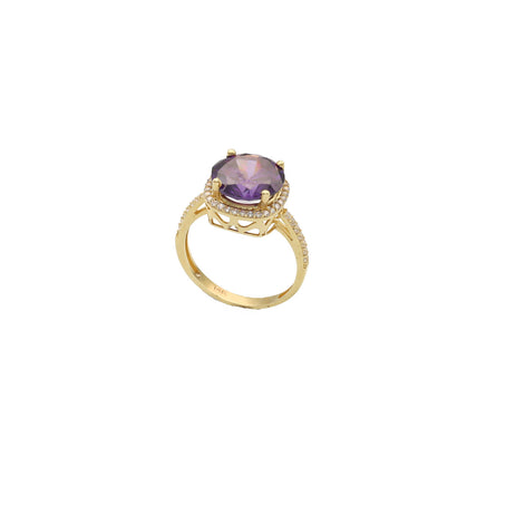 A 14 karat gold ring with a purple synthetic gemstone in a yellow gold band