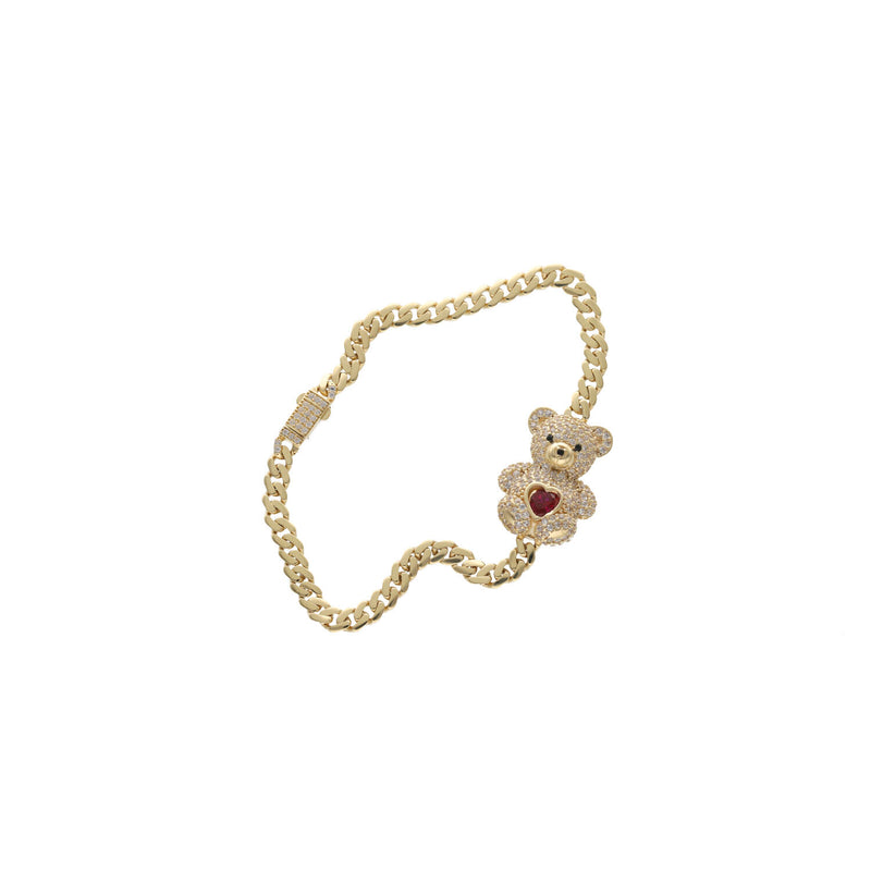 Close-up of teddy bear charm on 10K gold Cuban link bracelet showing heart detail in  red