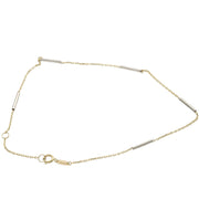14K two tone gold tube rolo anklet bracelet showing white and yellow gold combination on white background