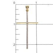 10 Karat Real Two Tone Gold lightweight Cross with a ruler for size reference  and one stone in the bail.