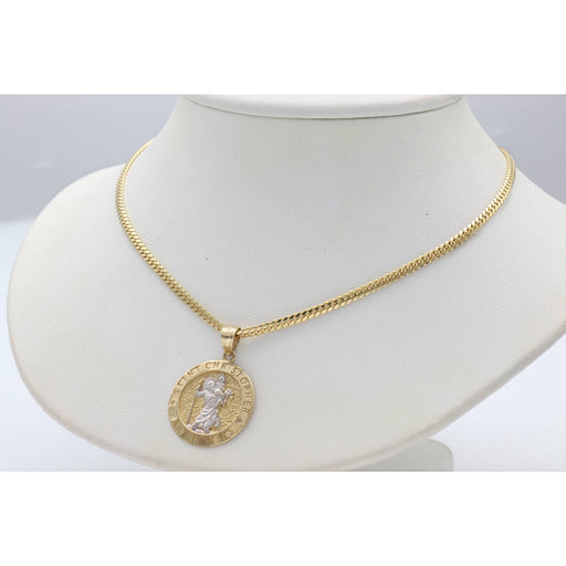 St Christopher Charm with Cuban Solid Gold Chain on a white neck in a gray background. The figure is detailed in white gold.