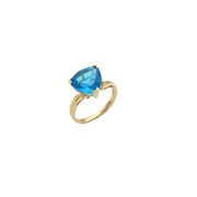 14 Karat Yellow Gold with a Topaz in a Trilliant cut set on a white background.