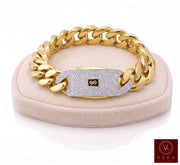 A Real 10k gold Monaco chain bracelet for men, 17mm width, showcased on a  beige velvet display stand by Veka Jewelry